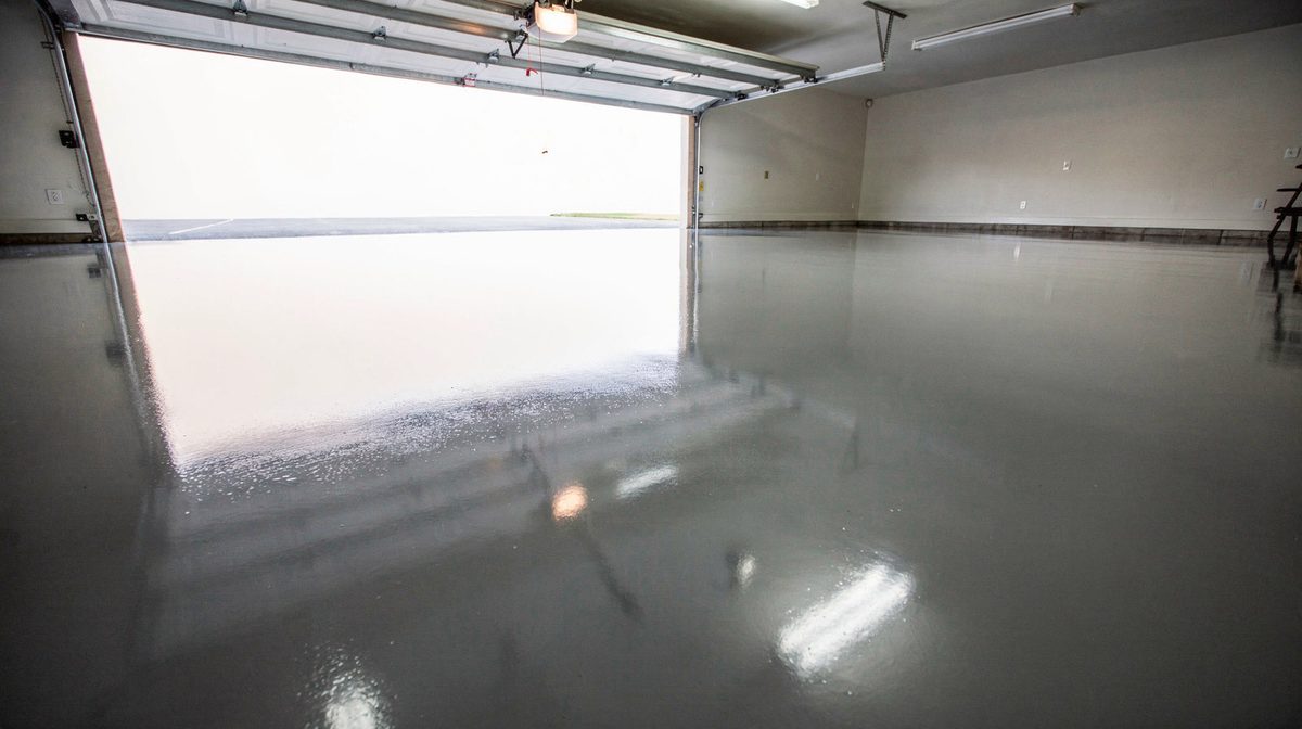 Glossy gray epoxy garage floor after coating in Beaumont, TX